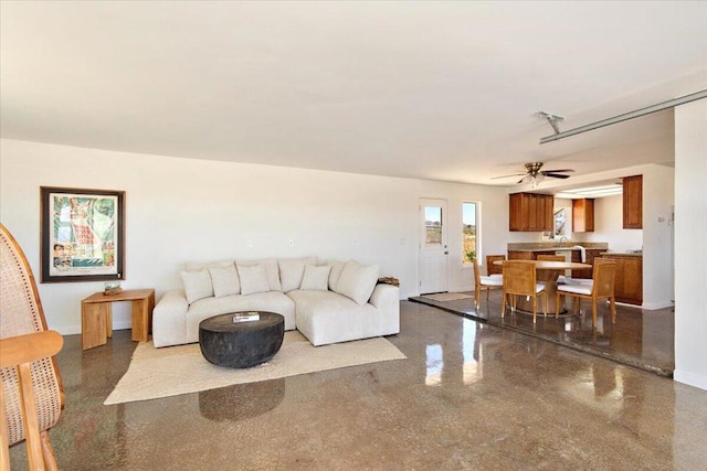 living room featuring ceiling fan