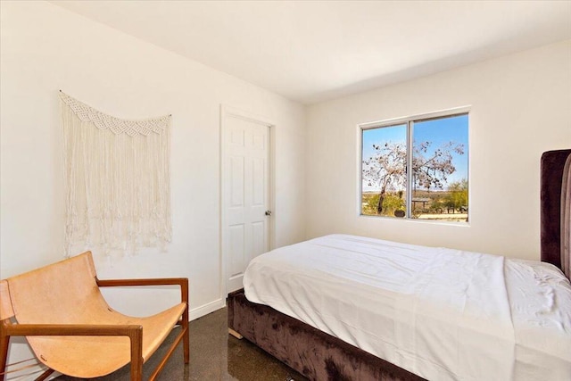 bedroom featuring dark colored carpet