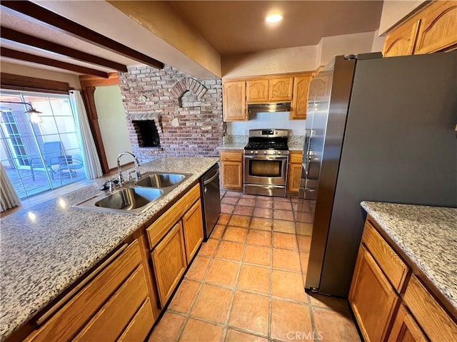 kitchen with appliances with stainless steel finishes, sink, light stone counters, light tile patterned floors, and beam ceiling