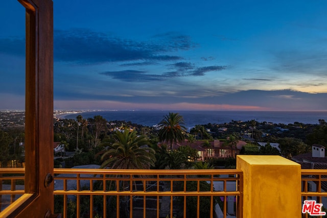 balcony at dusk with a water view