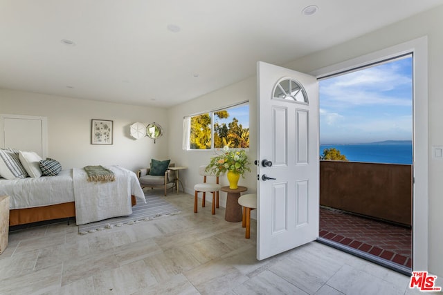 bedroom featuring a water view