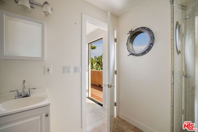 bathroom with vanity and walk in shower