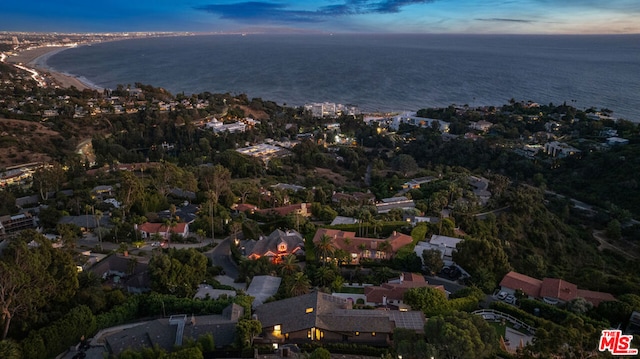 aerial view at dusk with a water view