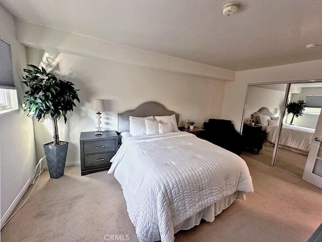 carpeted bedroom with a closet