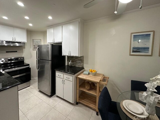 kitchen featuring appliances with stainless steel finishes, white cabinetry, tasteful backsplash, light tile patterned floors, and crown molding