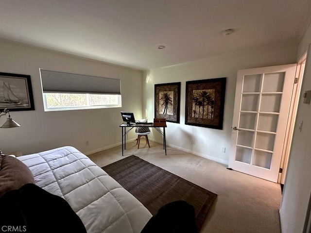 bedroom with light colored carpet