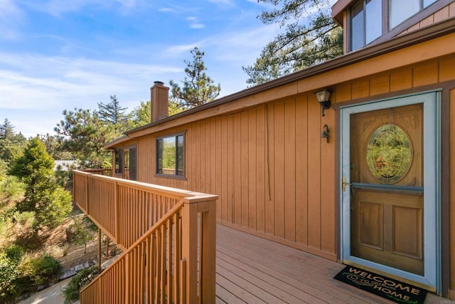 doorway to property with a wooden deck