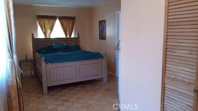 bedroom featuring light parquet floors