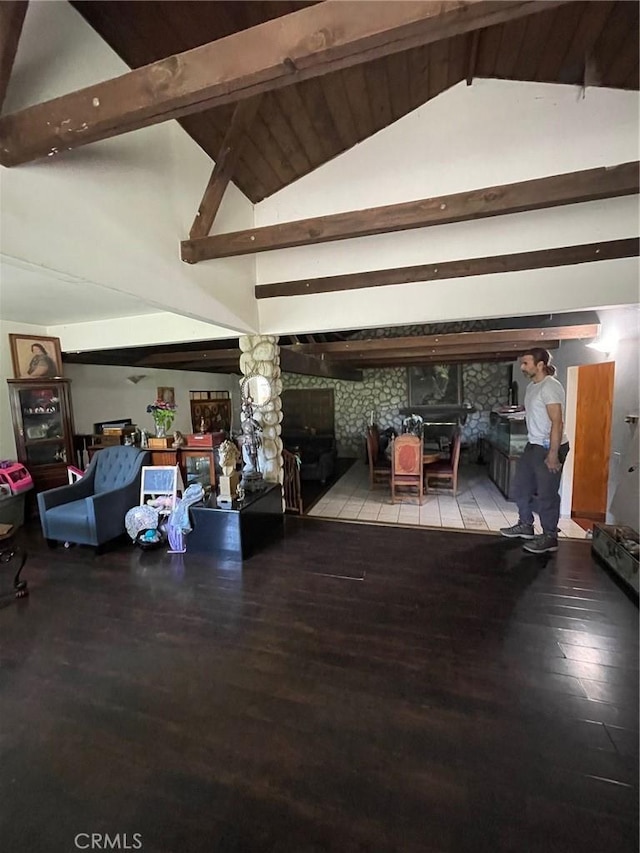 bedroom featuring lofted ceiling with beams and wood-type flooring