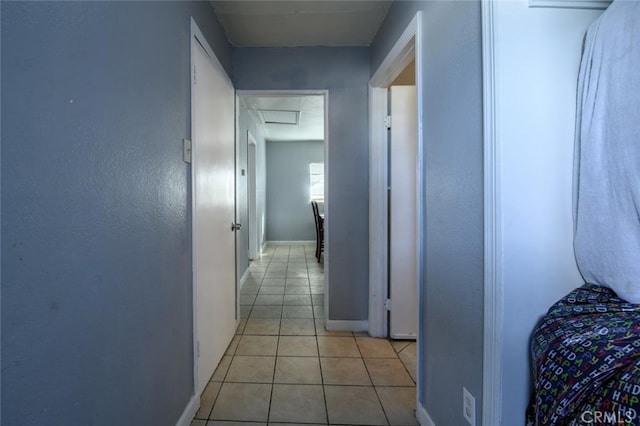 hallway with light tile patterned floors