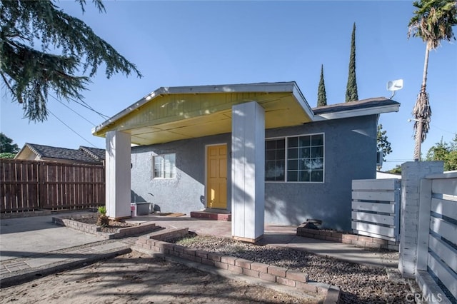 rear view of property with a patio area