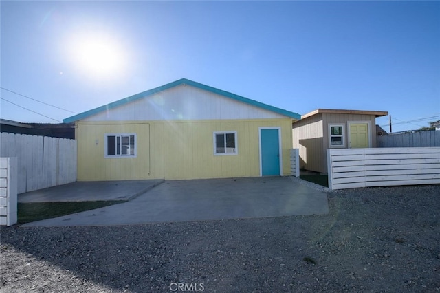 view of side of property featuring a patio