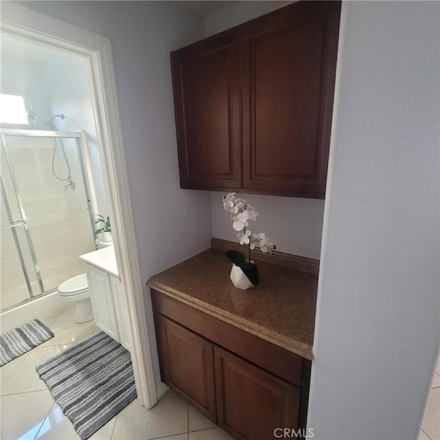 3887 Via Zumaya St, Corona, CA 92881 - bathroom with a shower stall, vanity, and tile patterned floors