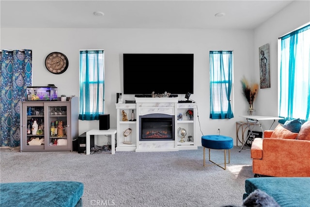 carpeted living room featuring plenty of natural light