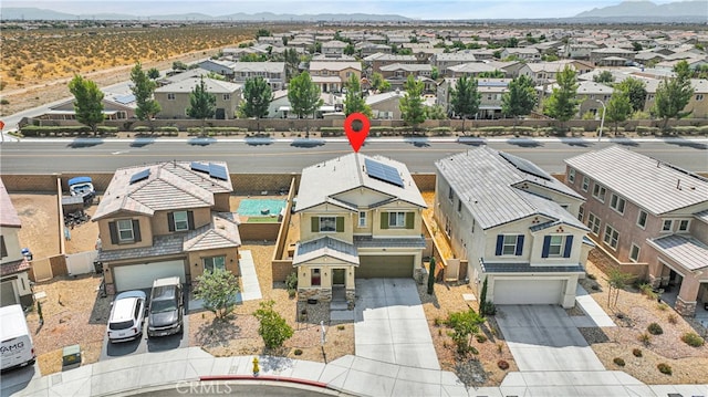 birds eye view of property with a mountain view