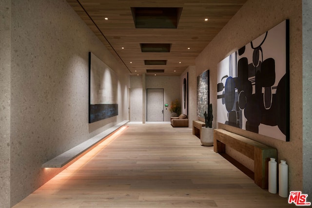 hallway featuring wood ceiling and light wood-type flooring