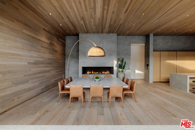 unfurnished dining area featuring wood ceiling and light hardwood / wood-style floors