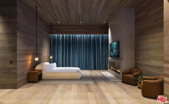 interior space featuring wood walls, wooden ceiling, and light hardwood / wood-style floors