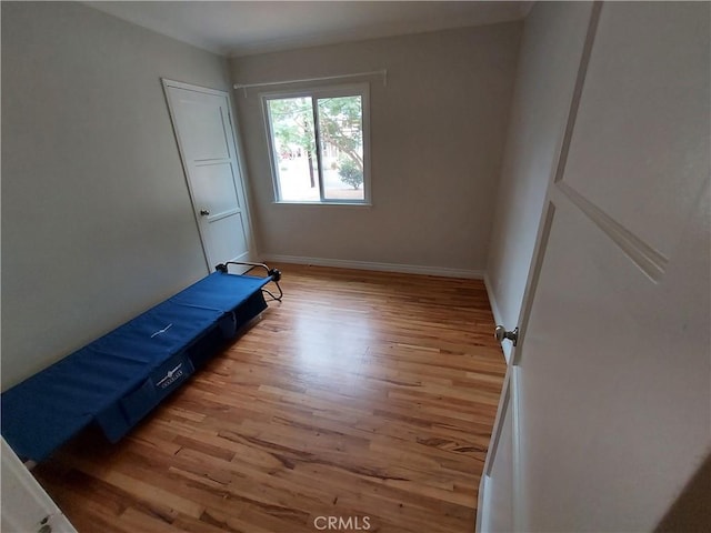 bedroom with light hardwood / wood-style floors