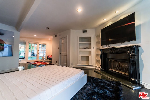 bedroom with dark hardwood / wood-style floors