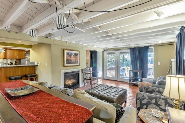 tiled living room featuring french doors and beam ceiling