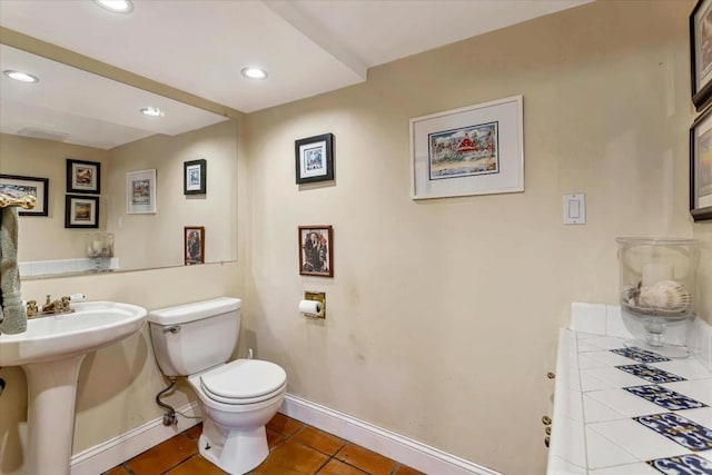 bathroom with tile patterned flooring and toilet