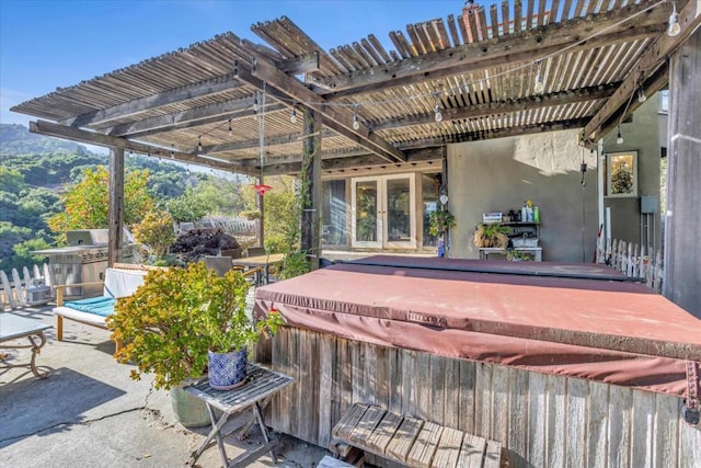 view of patio featuring a pergola and a hot tub