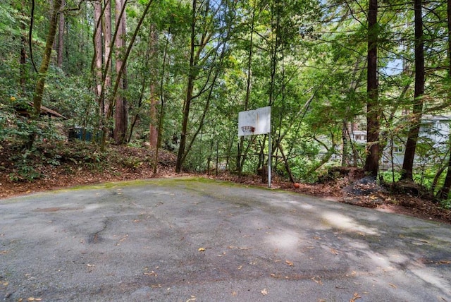 view of patio / terrace with basketball hoop