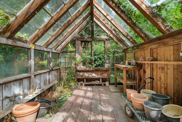 sunroom / solarium featuring vaulted ceiling