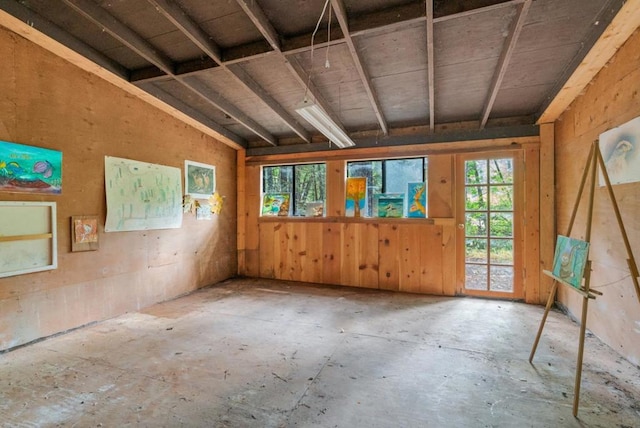 miscellaneous room with lofted ceiling