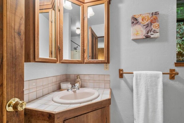 bathroom with vanity and backsplash