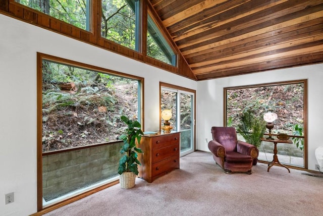 living area featuring high vaulted ceiling, light colored carpet, a healthy amount of sunlight, and wooden ceiling