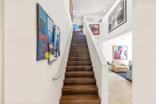 stairway with tile patterned flooring