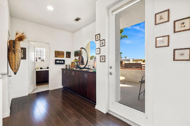 interior space with dark hardwood / wood-style floors