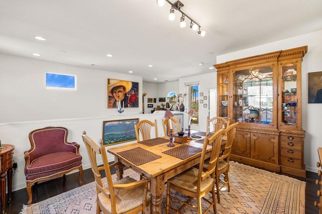 dining space with wood-type flooring