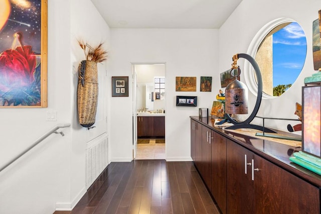 corridor with dark hardwood / wood-style floors