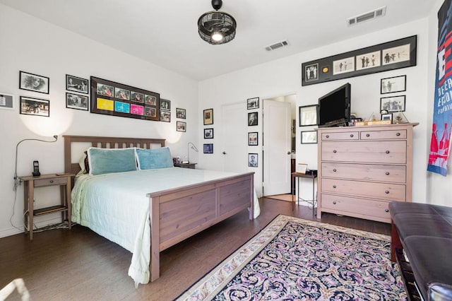 bedroom featuring dark hardwood / wood-style floors