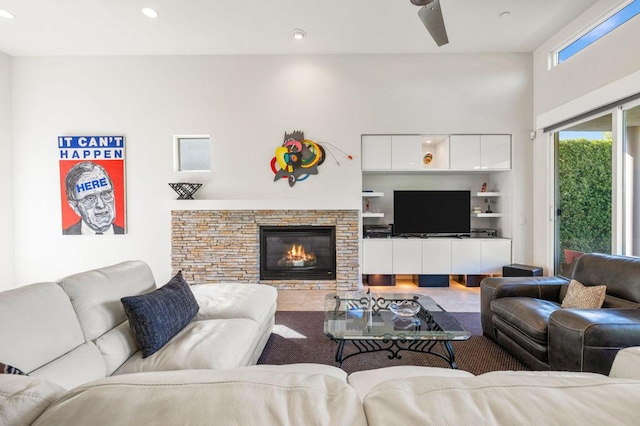 living room with a stone fireplace