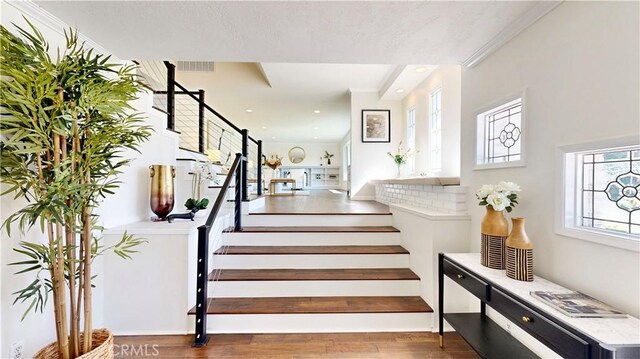 stairs with hardwood / wood-style floors