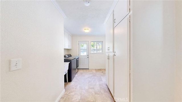 interior space featuring washing machine and dryer and crown molding