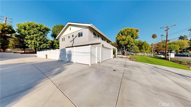 view of side of home featuring a lawn