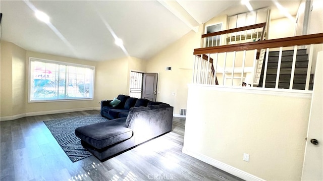 living room with lofted ceiling and hardwood / wood-style floors