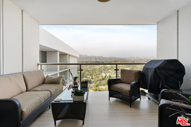 balcony featuring area for grilling and an outdoor hangout area