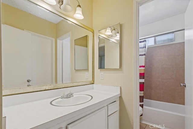 full bathroom featuring vanity, shower / tub combo, and toilet