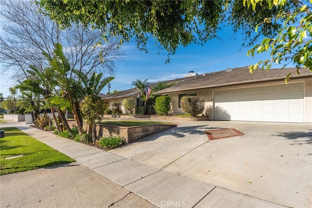 ranch-style home featuring a garage