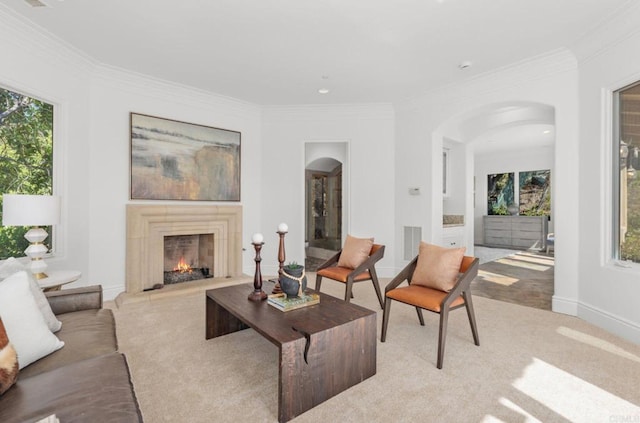 living room with light colored carpet, plenty of natural light, and ornamental molding