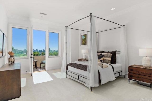 carpeted bedroom featuring crown molding