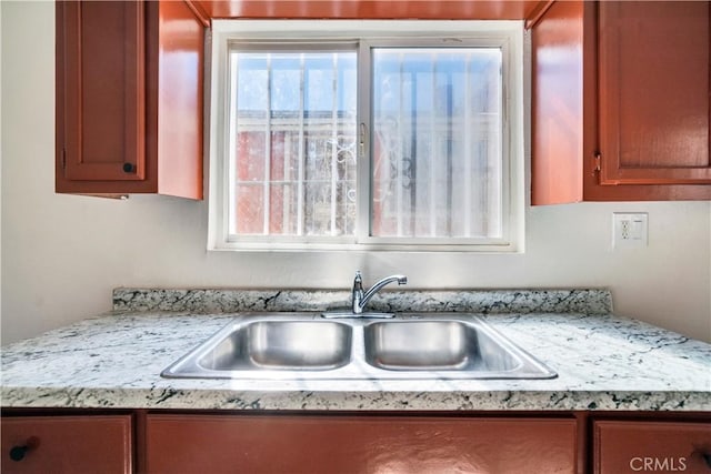 916 W 88th St, Los Angeles, CA 90044 - kitchen with a sink and brown cabinets