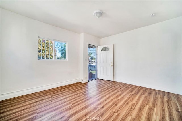 916 W 88th St, Los Angeles, CA 90044 - empty room with baseboards and light wood-style flooring