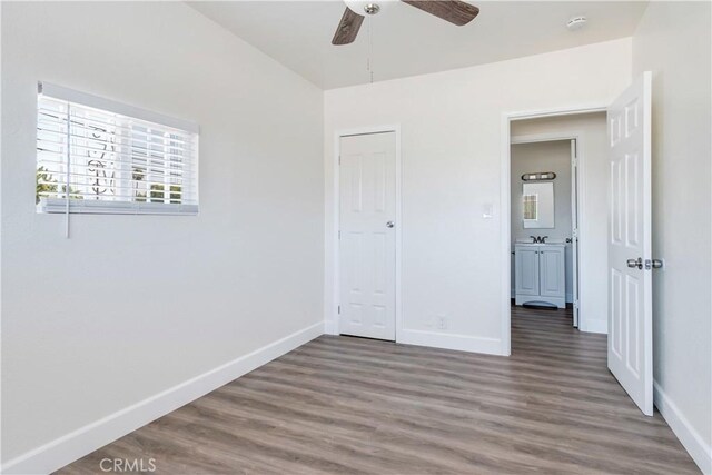 unfurnished bedroom with hardwood / wood-style floors and ceiling fan